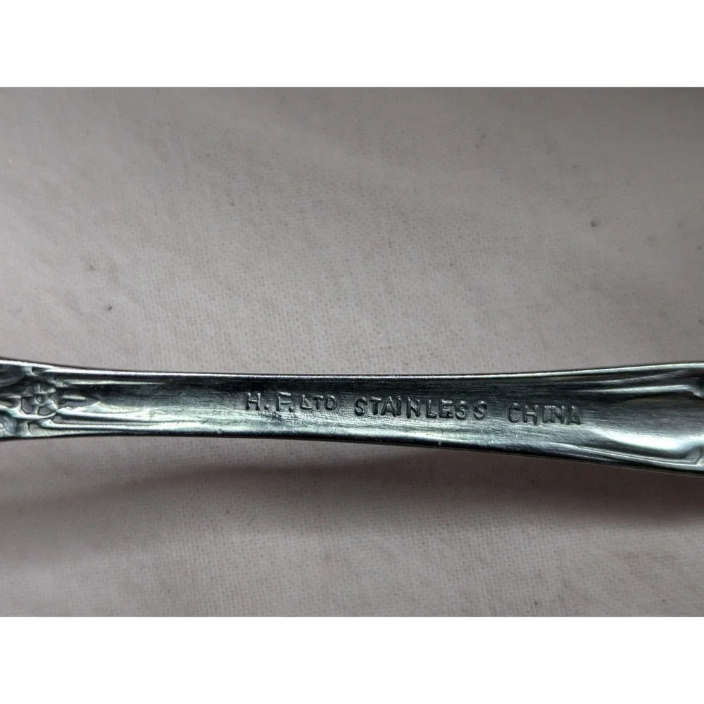 7 lot H.F. LTD Stainless stamped flower pattern 7